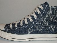 Blue Denim Embroidered High Top Chucks  Outside view of a left blue denim high top with stitched details.
