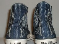 Blue Denim Embroidered High Top Chucks  Rear view of blue denim high tops with stitched details.