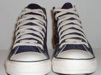 Blue Denim Embroidered High Top Chucks  Front view of blue denim high tops with stitched details.