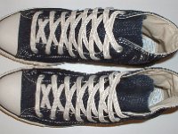 Blue Denim Embroidered High Top Chucks  Top view of blue denim high tops with stitched details.