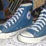 Blue High Top Chucks  Angled side view of bright blue high tops.