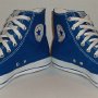 Blue High Top Chucks  Angled frontr view of royal blue high top chucks.