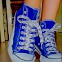 Blue High Top Chucks  Wearing royal blue high tops with print shoelaces.