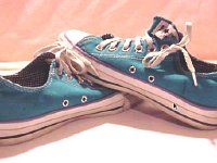 Blue Low Cut Chucks  Angled side views of turquoise low cuts.