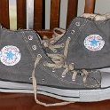 Brad Deniston Collection of Chucks  Inside patch views of distressed black denim high tops with hemp shoelaces.