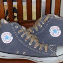Brad Deniston Collection of Chucks  Inside patch views of distressed blue denim high tops with hemp shoelaces.