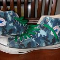 Brad Deniston Collection of Chucks  Inside patch views of blue camouflage high tops with green shoelaces.
