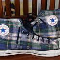 Brad Deniston Collection of Chucks  Inside patch views of blue plaid high tops.