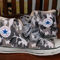 Brad Deniston Collection of Chucks  Inside patch views of brown camouflage high tops.