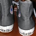 Brad Deniston Collection of Chucks  Rear view of charcoal grey high tops with gray shoelaces.