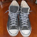 Brad Deniston Collection of Chucks  Top view of charcoal grey high tops with gray shoelaces.
