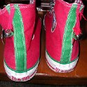 Brad Deniston Collection of Chucks  Rear view of red and green Christmas high tops