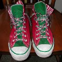 Brad Deniston Collection of Chucks  Front view of red and green Christmas high tops