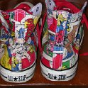 Brad Deniston Collection of Chucks  Rear view of comic print high tops with red shoelaces.