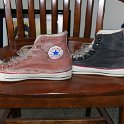 Brad Deniston Collection of Chucks  Left side views of painted white high top chucks.