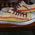Brad Deniston Collection of Chucks  Side view of painted low cuts.