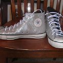 Brad Deniston Collection of Chucks  Front and inside patch views of silver vinyl high tops.