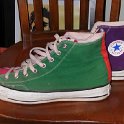 Brad Deniston Collection of Chucks  Left side view of green, red and purple tricolor high tops.