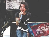 Breathe Carolina  Lead singer David Schmidt performs at Warped Tour in a pair of white low tops.