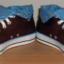 Brown High Top Chucks  Angled front view of rolled down brown and Carolina blue 2-tone high tops.