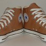Brown High Top Chucks  Angled front view of tannin high tops.