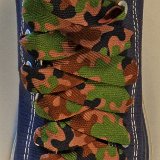 Camouflage Shoelaces on Chucks  Army Green Camouflage print shoelaces on a navy blue high top.
