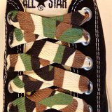 Camouflage Print Shoelaces On Chucks  Desert camouflage print shoelaces on black low cut chucks.