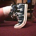 Camouflage Chucks  Wearing blue camouflage high tops, left outside view.