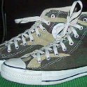 Camouflage Chucks  Green camouflage high tops, jungle pattern, side view.