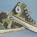 Camouflage Chucks  Worn green camouflage high tops, side view.