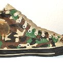 Camouflage Chucks  Inside patch view of a left olive green camouflage high top.