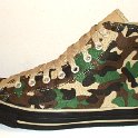 Camouflage Chucks  Outside view of a left olive green camouflage high top.