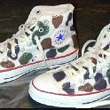 Camouflage Chucks  White camouflage high tops, angled side views.