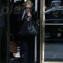 Celebrities Wearing Black Chucks  Charlize Theron walking through a door.