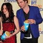 Celebrities Wearing Black Chucks  Actress Kristen Stewart and actor Robert Pattinson at the 18th Annual MTV Movie Awards, shot 7.