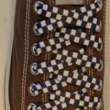 Checkered Laces on Chucks  Chocolate brown low top chuck with 45x3/8 inch black and white checkered shoelaces.