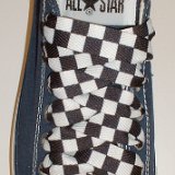 Black and White Checkered Shoelaces on Chucks  Navy blue low top chuck with black and white checkered shoelaces.