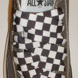 Black and White Checkered Shoelaces on Chucks  Charcoal grey low top chuck with black and white checkered shoelaces.
