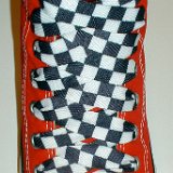 Black and White Checkered Shoelaces on Chucks  Red high top with black and white checkered shoelaces.