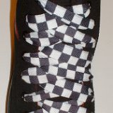 Black and White Checkered Shoelaces on Chucks  Anarchy black high top with black and white checkered shoelaces.
