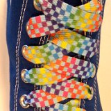 Rainbow Checkered Print Shoelaces On Chucks  Rainbow checkered print shoelace on a royal blue high top chuck.