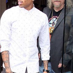 Chris Brown  Brown wearing optical white chucks while leaving a restaurant. : Chris Brown, TAG Toy Store, full length, signing autograph