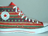 Christmas High Top Chucks  Inside patch view of a left holiday pattern and red satin 2-tone high top.