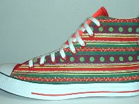 Christmas High Top Chucks  Outside view of a left holiday pattern and red satin 2-tone high top.