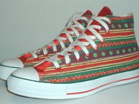 Christmas High Top Chucks  Angled side view of holiday pattern and red satin 2-tone high tops.