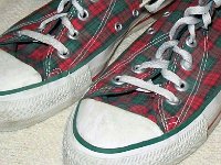 Christmas High Top Chucks  Closeup of the toecaps of a pair of Christmas high tops, showing the green and red piping.