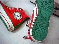 Christmas High Top Chucks  Red and green 2 tone Christmas high tops, showing the right inside patch and green sole.