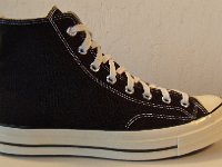 Chuck '70 Black High Tops  Outside view of a right Chuck '70 black high top.