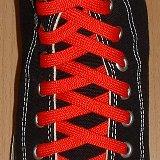 Red Classic Shoelaces  Black high top with red laces.