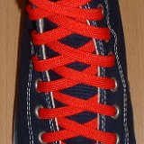 Red Classic Shoelaces  Navy blue high top with red laces.